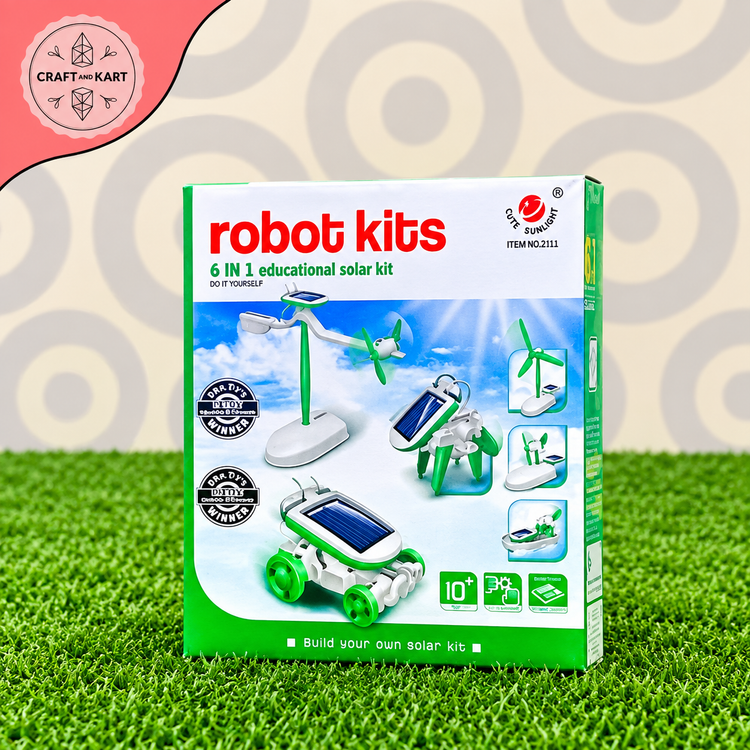 A retail box for a 'robot kits 6 in 1 educational solar kit' by Craft by Kart, displayed on a green grass-like surface with a patterned gray background. The packaging is primarily green and white with colorful graphics depicting solar-powered vehicles and wind turbines.
