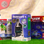 Boxed microscope with other educational toys on a grassy background