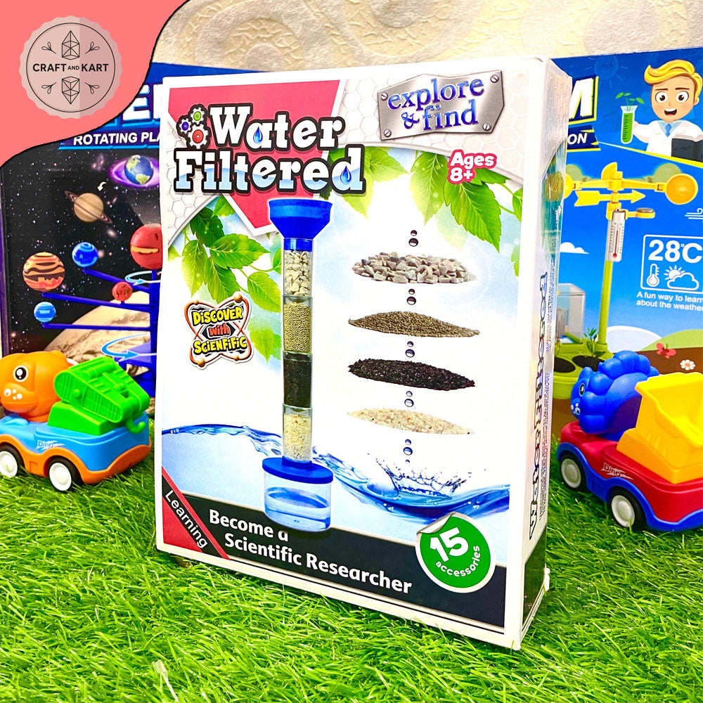 Science experiment kit packaging on grass with toy cars in the background